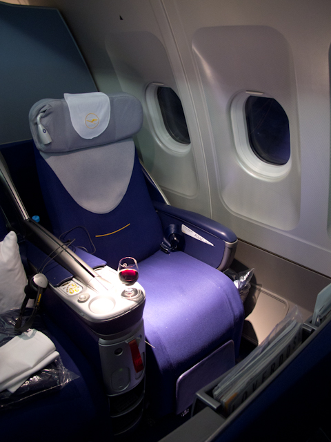 My seat, 11A. Nearly everything has been thought of in these clever seats designed for Lufthansa by Recaro. Photo © 2011 Aaron Saunders