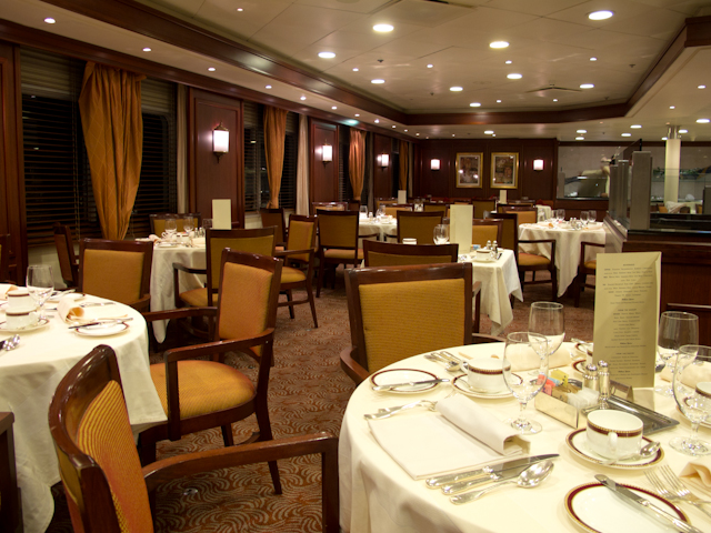 The attractive, wood-accented Restaurant aboard Silver Explorer, facing forward. Photo © 2012 Aaron Saunders