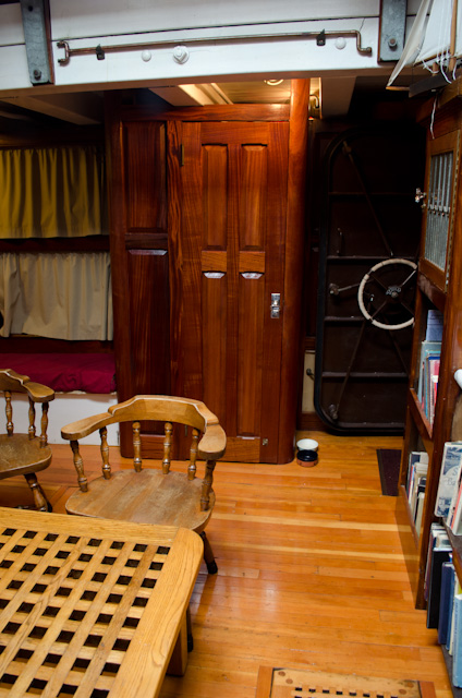Located just off the main lounge aboard the Schooner Zodiac, the door to my small-yet-cozy stateroom can be seen directly ahead (the wooden one). Photo © 2013 Aaron Saunders