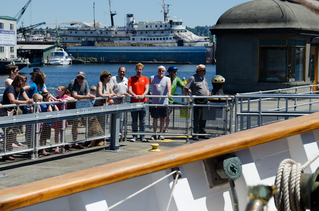 Onlookers watch as the lock is filled with water. Note the former Spirit of '98 in the background, in the process of becoming SS Legacy for Un-Cruise. Photo © 2013 Aaron Saunders