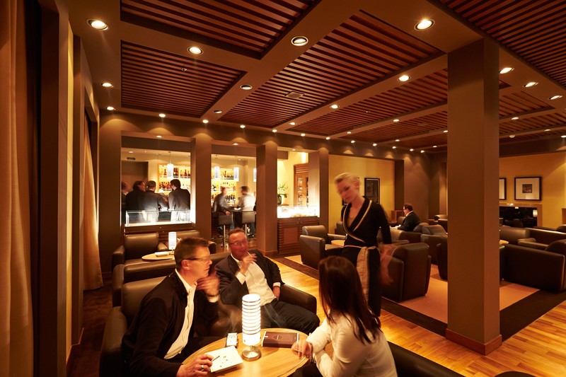 Other venues, like the clubby Herrenzimmer Bar, harken back to the 'golden age' of transatlantic travel. Photo courtesy of Hapag-Lloyd Cruises.