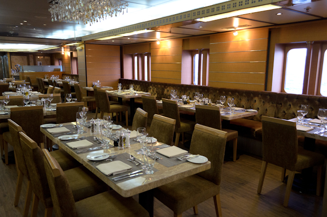 The Restaurant on Deck 2 doesn't span the width of the Silver Galapagos. Instead, it occupies a cozy area that runs along the port side of the ship. Photo © 2014 Aaron Saunders