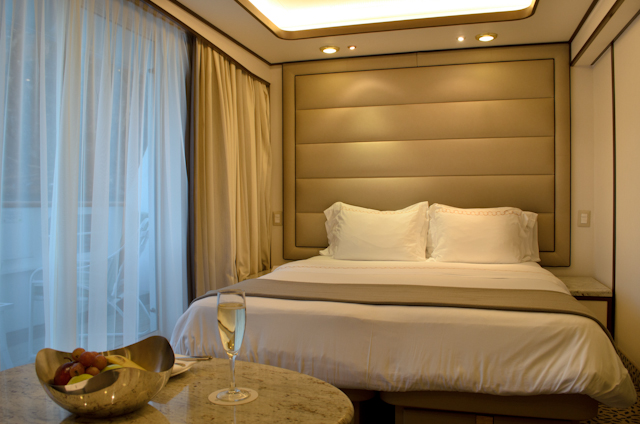 Deluxe Veranda Suites, like all suites aboard Silver Galapagos, have been extensively re-done. Wall treatments, the headboard behind the bed, curtains, chairs, tables, and even the extensive writing desk are all completely new. Photo © 2014 Aaron Saunders