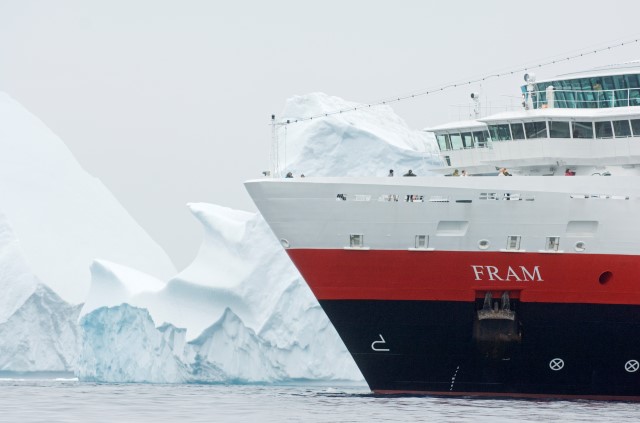Hurtigruten's FRAM stands out against the monochromatic colors of Antarctica. Photo courtesy of Hurtigruten.