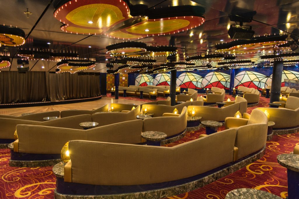 For some reason, the Butterflies Lounge on Deck 1 reminds me of Carnival's earlier Fantasy-class ships. Photo © 2016 Aaron Saunders