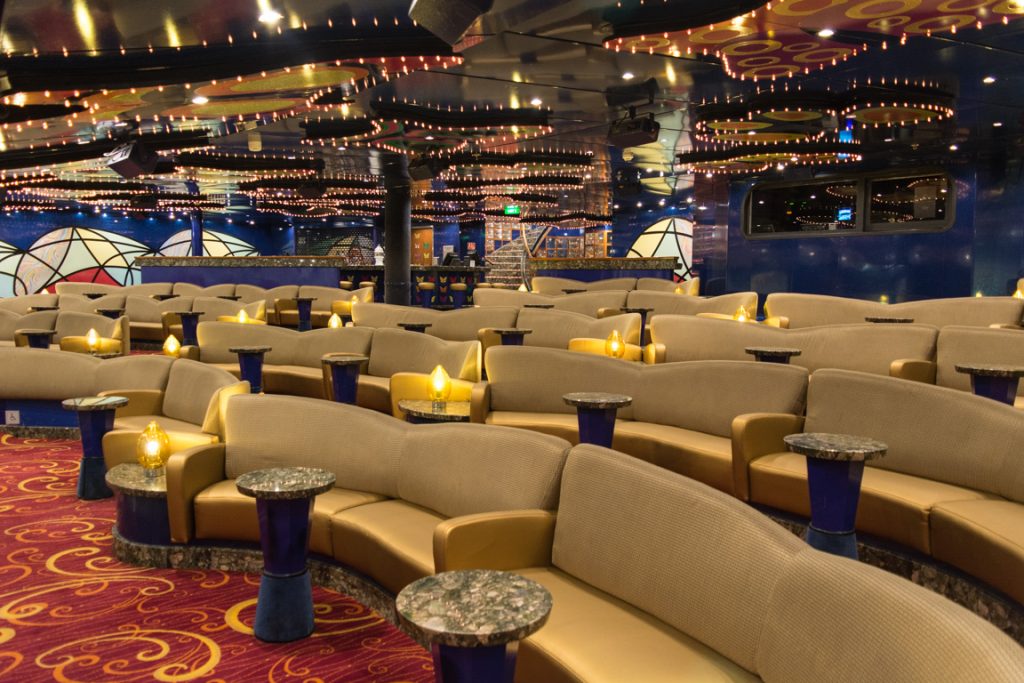 The location for Carnival's Punchliner Comedy Club performances, the Butterflies Lounge features plenty of cozy seating options...Photo © 2016 Aaron Saunders