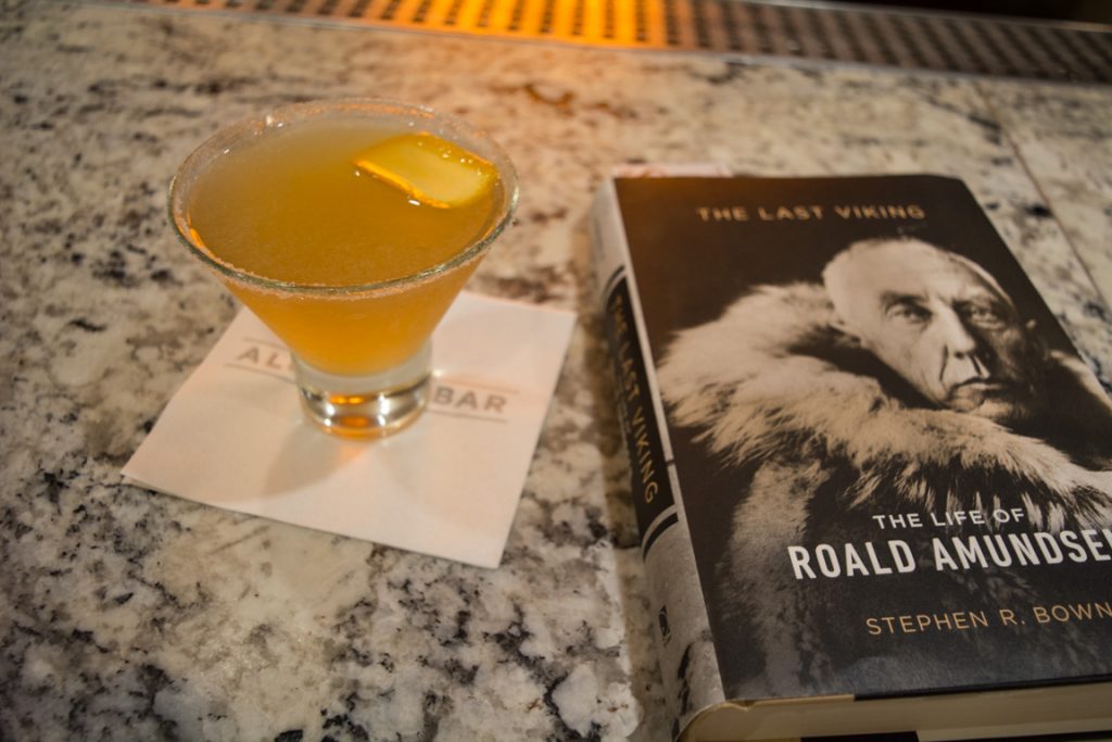 What better way to end the evening? Cocktails and reading in the Alchemy Bar on Deck 2 aft. Photo © 2016 Aaron Saunders