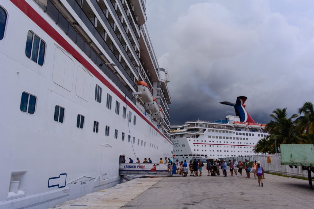 Re-boarding Carnival Pride at 12:45 p.m. Carnival used both forward and aft gangways to re-board guests as sailing time approached. Photo © 2016 Aaron Saunders