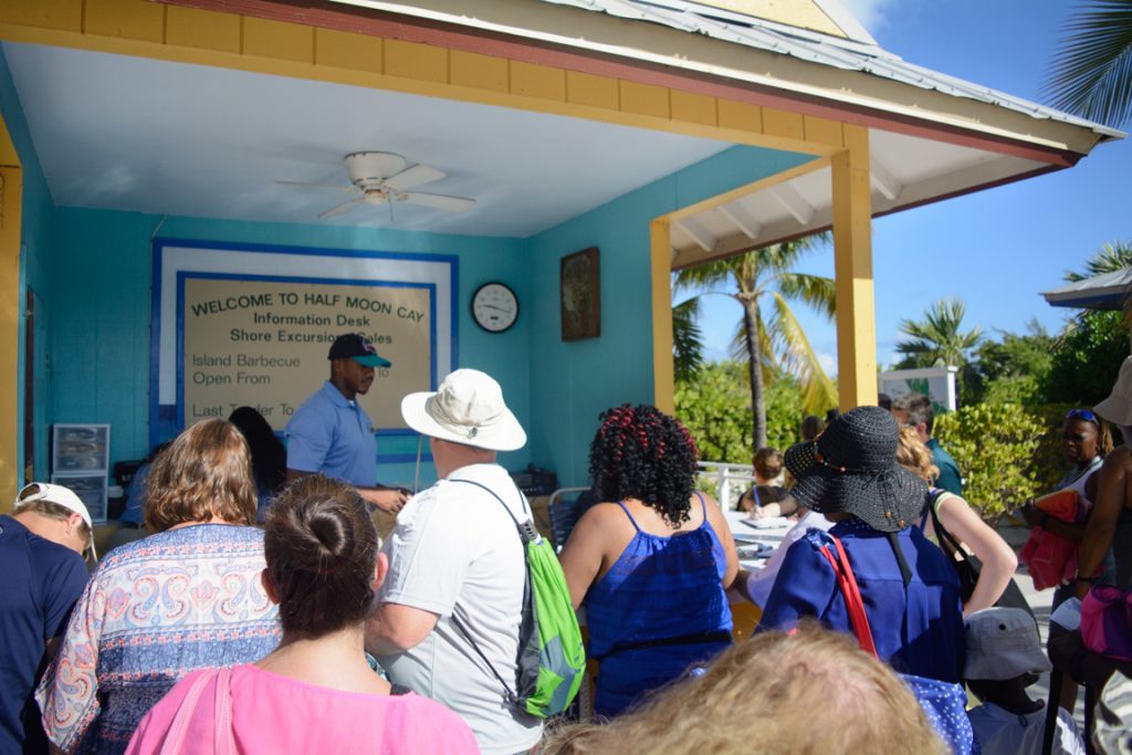 Once ashore on Half Moon Cay, you have to exchange your shore excursion tickets and sign waivers at this booth, which creates some frustratingly-long lineups. Photo © 2016 Aaron Saunders