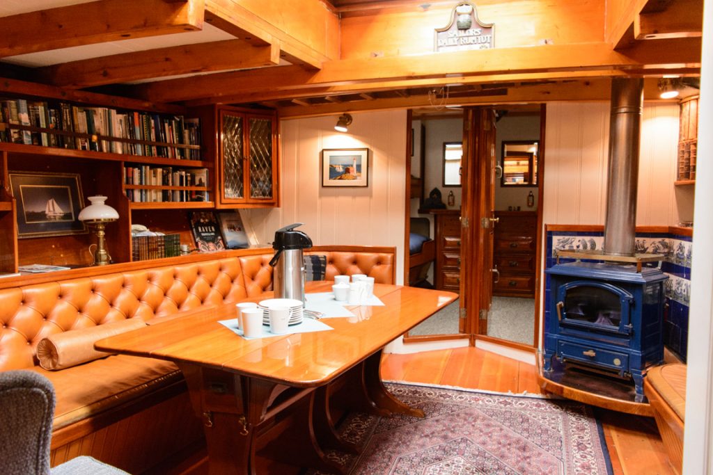 Welcome aboard! Passing Cloud's main lounge comfortably seats all six guests onboard, and is one of the most welcoming spaces on any ship. Photo © 2016 Aaron Saunders