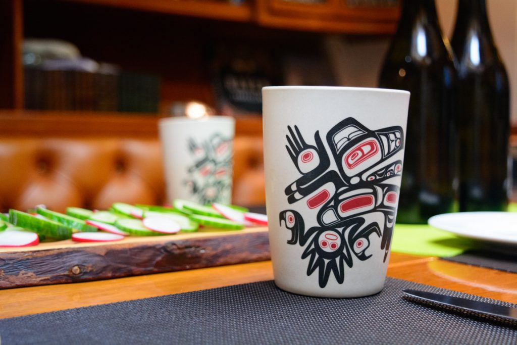 Haida-inspired water cups grace the table in the lounge, where all meals are served during inclement weather. Photo © 2016 Aaron Saunders